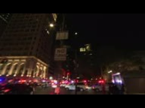 Violence and arrests as New York imposes curfew