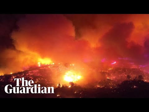 Aerial footage shows Rhodes wildfire turning sky orange