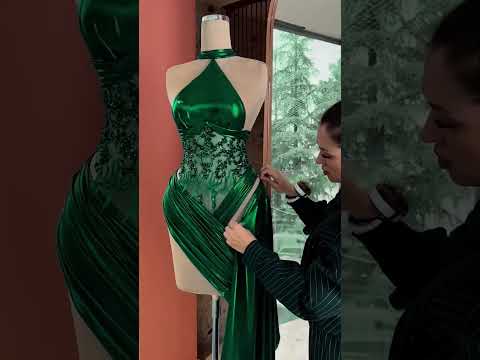 To order this emerald green dress DM This liquid satin gown features a sculpted one-shoulder