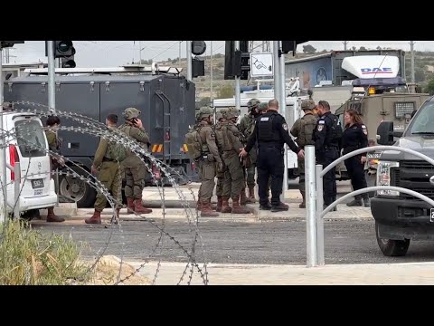 Israeli troops kill 2 Palestinians who the military said attacked a checkpoint