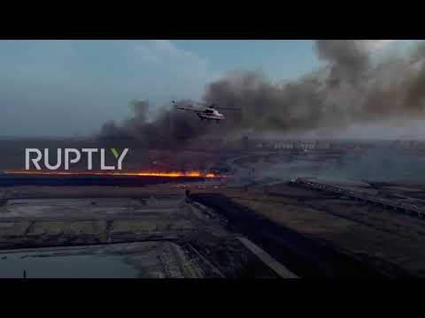 Russia: Drone captures aerial firefighters battling massive bulrush blaze in Rostov-on-Don