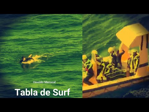 UN CUBANO ENCIMA DE UNA TABLA DE SURF ES RECOGIDO POR OTRO CRUCERO
