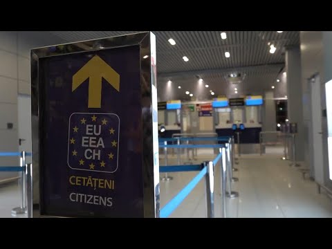 Travellers arrive at Bucharest airport as passport and visa checks for Schengen area passengers are