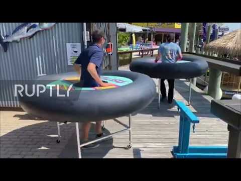 Seafood restaurant puts diners in bumper boat tubes to ensure social distancing