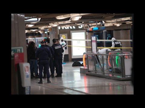 Police investigators work at Gare de Lyon station after attack