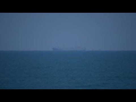 US Navy ship and other vessels visible off Gaza's coast amid efforts to boost aid