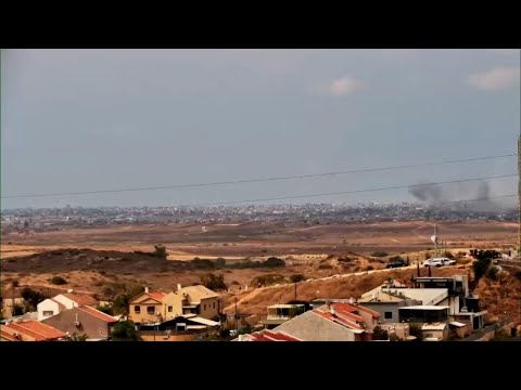 Smoke seen rising on the Gaza skyline from southern Israel