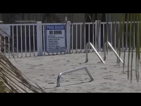 Florida digs out of mountains of sand swept in by back-to-back hurricanes