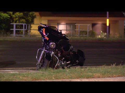 Man on motorcycle dragged through bar parking lot by suspect in truck, police say