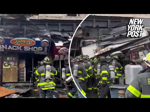 Three NYC firefighters wounded after metal shop awnings fall and crush them during fire