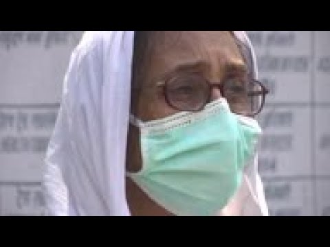 Hurried funerals as India's virus cases climb