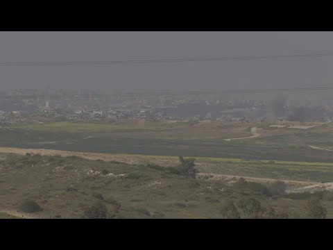 Explosions and Israeli military movement visible along Gaza border