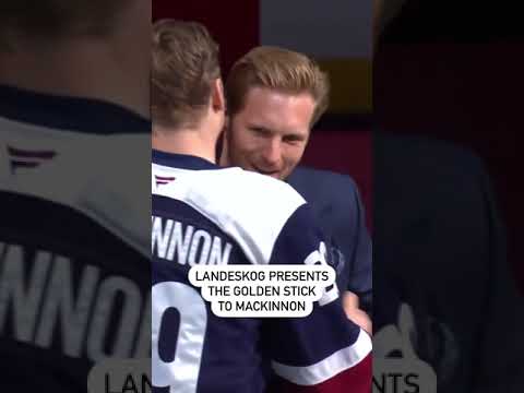 Gabriel Landeskog Presents Nathan MacKinnon With His Golden Stick