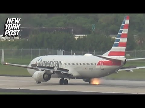 Wheel on American Airlines Boeing plane bursts into flames just ahead of takeoff