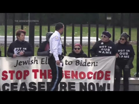 Protesters chain themselves to White House fence