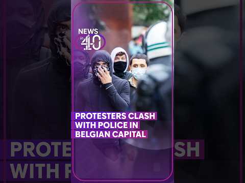 Protesters clash with police in Belgium as tens of thousands march against cost of living