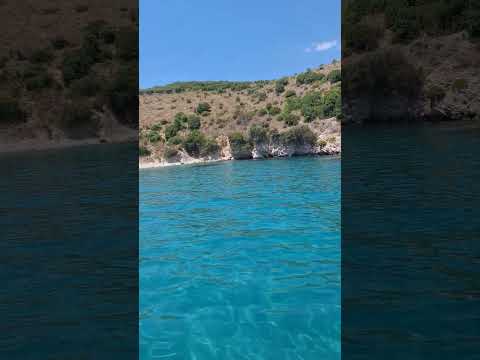 Crystal clear turquoise blue waters on remote beach of northwestern Greece. Excursiin Boat access