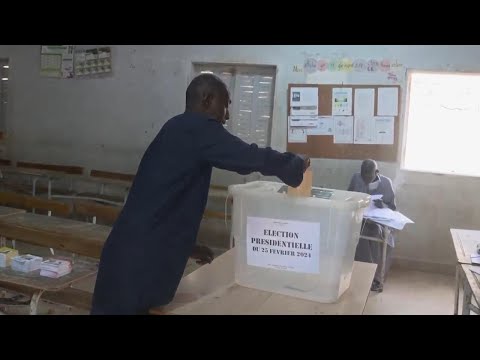 Voters line up as polls open in Senegal's delayed presidential election