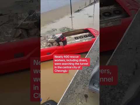 Rescuers pull bodies from flooded tunnel