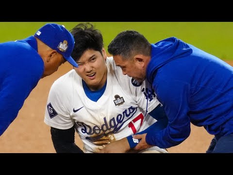 Shohei Ohtani leaves the field with a trainer after attempting to steal 2B in the 7th inning | 大谷翔平