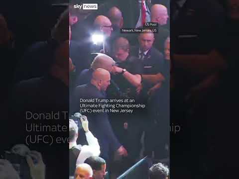 Trump gets warm welcome at fight event