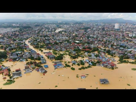 Submerged streets in north Vietnam as thousands stranded after record flooding | AFP
