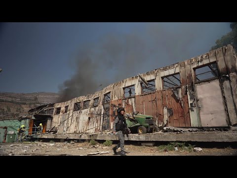 Firefighters battle blaze in northern Israeli town ignited by projectile from Lebanon