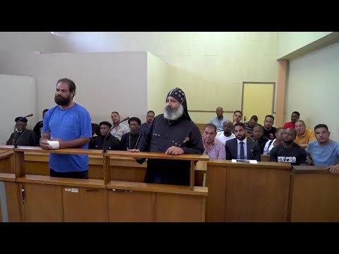 Two men accused of murdering three Egyptian Coptic monks appear in a South African court