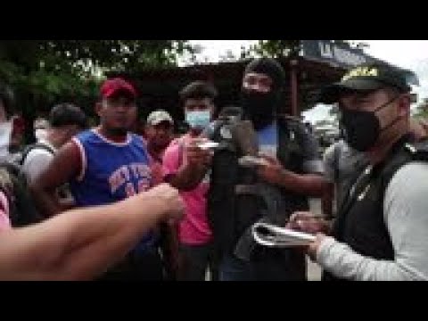 Many in migrant caravan bused back to Honduran border