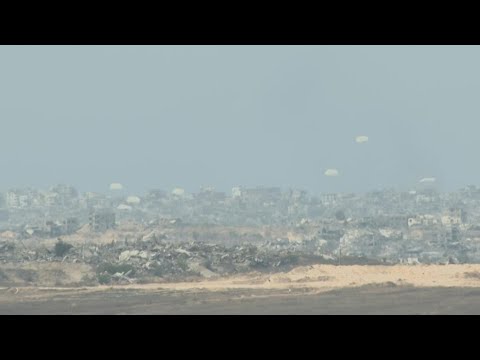 Parachutes fall during airdrop over northern Gaza | AFP