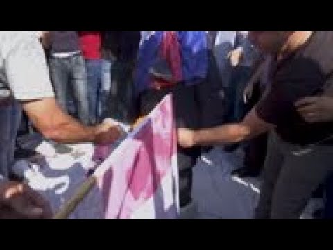 Macron effigy burned in WBank, scuffles in Jerusalem