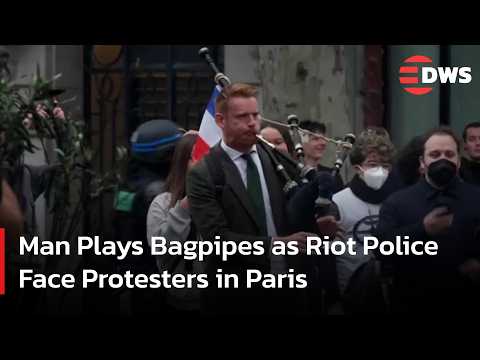 Unusual Scene: <strong>Man</strong> Plays Bagpipes as Riot Police Face Protesters in <strong>Paris</strong> | DWS News | AC15