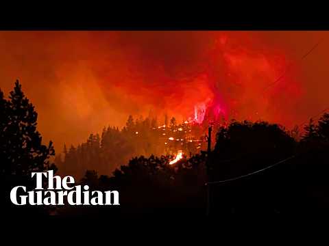 Fast-moving wildfire engulfs hills in western Canada