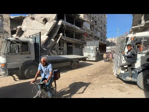 Empty trucks leave Khan Yunis to collect aid as Gaza ceasefire begins | AFP