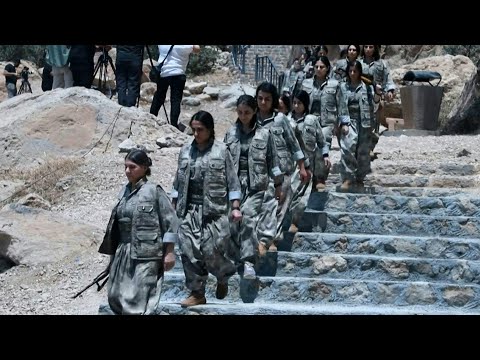 PKK fighters arrive with weapons at disarmament ceremony in northern Iraq | AFP