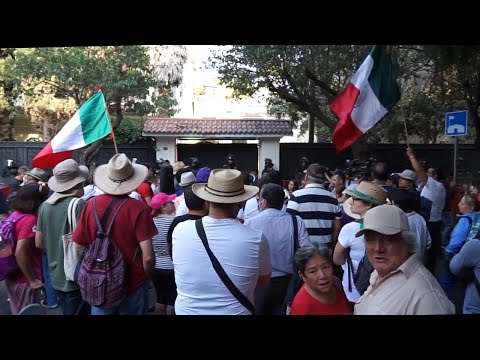 Protesters gather outside Ecuadorian embassy in Mexico City after diplomatic breakdown between the c