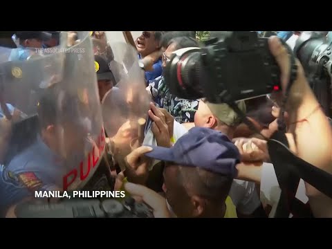 Filipinos protest outside Chinese consulate to denounce Beijing's 'trespass' rules in disputed water