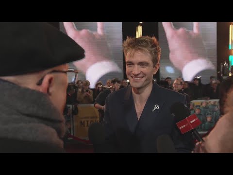 Dean talks to Robert Pattinson on the red carpet for  ‘Mickey 17’