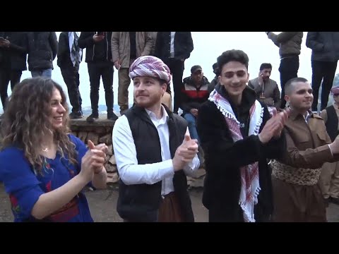 Iraqi Kurds celebrate Newroz by carrying torches and fireworks