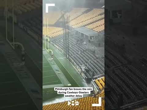 VIDEO: Pittsburgh fan braves the rain during Cowboys-Steelers weather delay