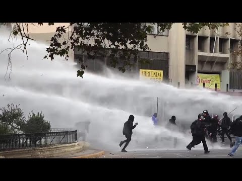 Water cannons used to disperse some at Chile May Day march