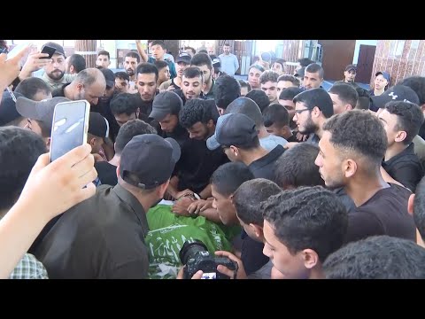 Hundreds attend funeral for Palestinian teen killed in explosion during protest near border with Isr