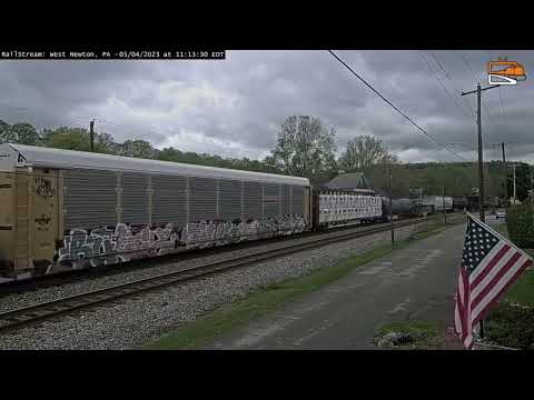 CSX 506 leads a manifest with BNSF 557 in West Newton, PA