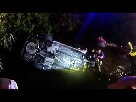 Officers SCRAMBLE to Save Woman and Two Children from Overturned Car in Canal