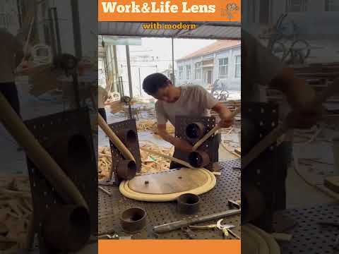 Worker at furniture factory steams wooden rods for pliability, enabling creation of curved furniture