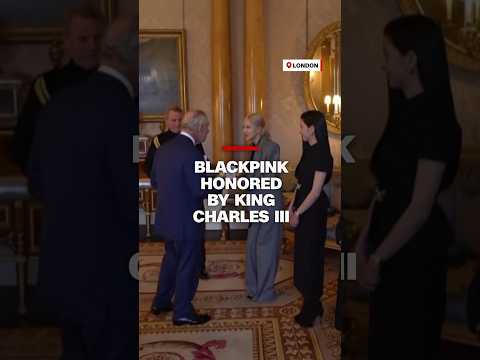King Charles III presents Blackpink with honorary Member of the Order of the British Empire medals.