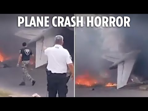 Two dead in horror plane crash after jet smashes into building while trying to land