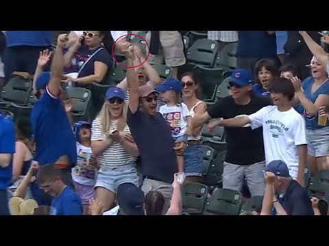 Fan makes INCREDIBLE catch while holding kid!