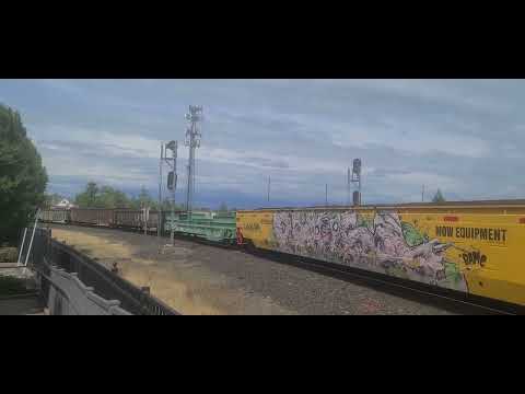 Union Pacific 9912 leads a manifest with MOW equipment in Roseville, CA