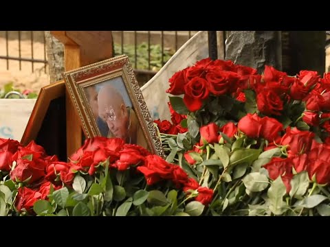 People place wreaths by Prigozhin's grave in St. Petersburg